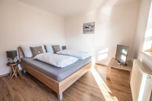 Łóżko lub łóżka w pokoju w obiekcie Apartments Wimpissinger