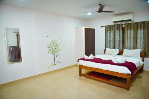 Postel nebo postele na pokoji v ubytování Idyllic Inn Calangute Goa