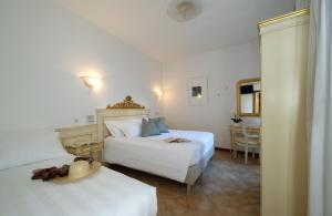 Voodi või voodid majutusasutuse Hotel Guerrini toas