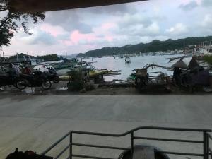 a view of a body of water with boats in it at Elmo’s place in El Nido