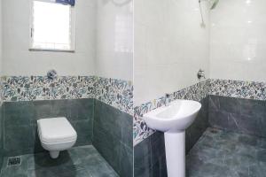 a bathroom with a toilet and a sink at FabHotel Skyline I in Méribel Village