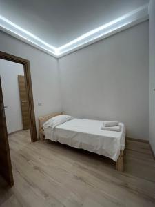 מיטה או מיטות בחדר ב-Villa Milano Apt. n. 2