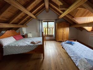 A bed or beds in a room at Agri Camp Dolomiti