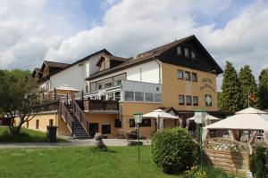 a large building with a staircase in front of it at Hotel Alte Viehweide in Helferskirchen