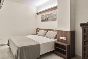 Postel nebo postele na pokoji v ubytování Sunway Playa Golf & Spa Sitges