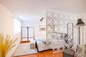 a bedroom with a large white bed in a room at Gaia Elegant Retreat I in Canidelo +20 photos
