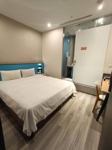 Letto o letti in una camera di Walker-Taoyuan