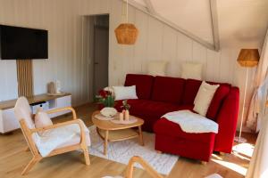 TV a/nebo společenská místnost v ubytování Ferienhaus Kiek in Glücksburg + 27 fotografií