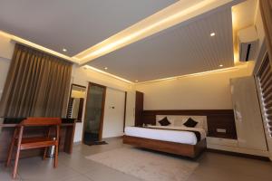 A bed or beds in a room at jungle view resort