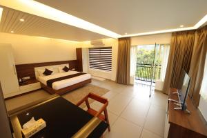 A bed or beds in a room at jungle view resort