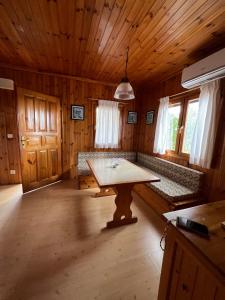 a large room with a table in a cabin at Camping Playa Las Dunas in El Puerto de Santa María