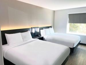 Postel nebo postele na pokoji v ubytování Hawthorn Extended Stay by Wyndham Hobbs