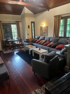 a living room with a couch and a table at Espectacular Casa con Piscina en Allariz in Allariz
