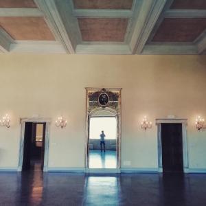 a person standing in front of a mirror in a room at Grand Hotel Dei Castelli in Sestri Levante