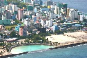 an aerial view of a beach and a city at Ontrack Travel in Male City