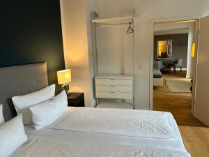 Postel nebo postele na pokoji v ubytování DK Hotel Heidelberg