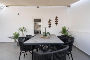 a dining room with a table and chairs at Athens Hills, Boutique Apartments in Athens