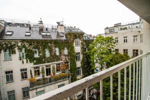 a view from the balcony of a building with ivy at Karmeliter Flat | contactless check-in in Vienna