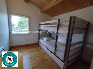 Ένα ή περισσότερα κρεβάτια σε δωμάτιο στο Maison Oléron avec piscine +20 φωτογραφίες