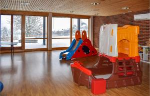 a childrens play room with a slide in it at Nice Apartment In Geilo With Kitchen in Geilo