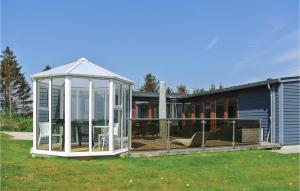 a house with a gazebo in the yard at Beautiful Home In Rudkbing With 3 Bedrooms, Sauna And Wifi in Spodsbjerg