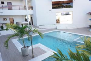 a swimming pool in the middle of a building at Pousada Brisas da Natureza in Satuba