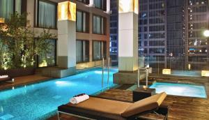 a swimming pool in the middle of a building at JW Marriott Hotel Mexico City Santa Fe in Mexico City