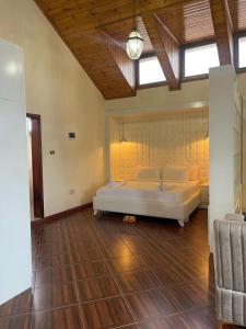 a bedroom with a large white bed in a room at Social House in Addis Ababa