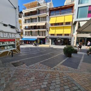 an empty street in a city with buildings at Apartamento Cruzamar IF Beach in Benidorm