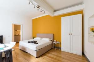 A bed or beds in a room at Pantheon Rome Relais