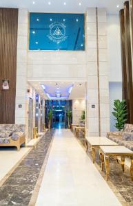 a view of the lobby of a building with benches at فندق ليمة الذهبي in Mecca