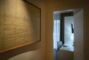 a room with a large painting on the wall at B&B H68 in Alassio
