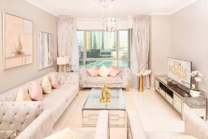 a living room with a couch and a table at Elite Royal Apartment - Full Burj Khalifa & Fountain View - 2 Bedrooms + 1 Open Bedroom Without Partition - Magnate in Dubai
