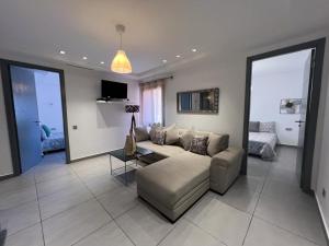 a living room with a couch and a table at AiM HOUSE in Marrakech
