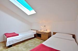 Posteľ alebo postele v izbe v ubytovaní Apartment Božiković - Jelsa - Vitarnja