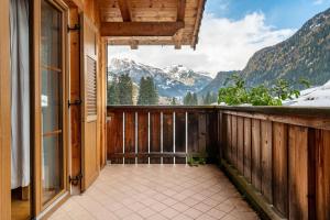 a balcony with a view of the mountains at Casa Titol Ami in Pozza di Fassa