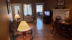 a living room with a couch and a table at Gatlinburg Chateau Condo 307 in Gatlinburg