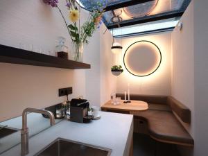 a bathroom with a sink and a mirror on the wall at vondice hotel in Amsterdam