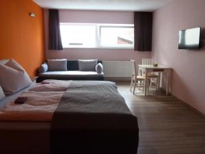 Ένα ή περισσότερα κρεβάτια σε δωμάτιο στο Wellnesshaus Waldmünchen