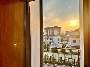 a window with a view of a city at Heng Ann Guest House in Melaka