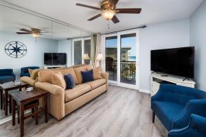 a living room with a couch and a flat screen tv at Nautilus 2609 Gulf View 2 Bedroom 6th Floor Free Beach Service in Fort Walton Beach