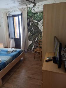 Postel nebo postele na pokoji v ubytování Antico Borgo - A due passi dalle Gole Alcantara