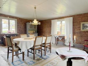 a dining room with a table and chairs at Historic villa in beautiful nature, Svenljunga in Svenljunga