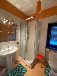 a bathroom with a shower and a sink and a toilet at B&B Il Sogno Cosenza in Cosenza