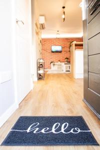 a lease rug on the floor of a living room with a door at The Rugby Accommodation in Rugby