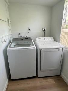 two washers and a washer and dryer in a room at Stylish Studio Brickell/Little Havana@ItalianPlaza in Miami