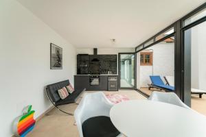 a kitchen and living room with a table and chairs at The El Paso in El Paso