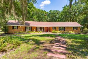 a brick house with a driveway in front of a yard at Golden Isles Lrge Home- Huge Pool, Hot Tub, Game Rm in Brunswick