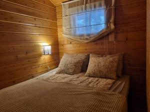 Postel nebo postele na pokoji v ubytování Revontulen Tupa