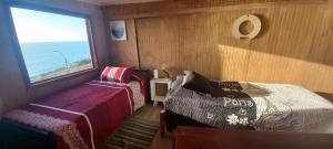 Postel nebo postele na pokoji v ubytování Casona El Faro